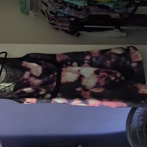 Knee length dress with lace neck detail.